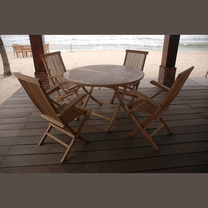 Wooden outdoor furniture set on a deck with a beach background