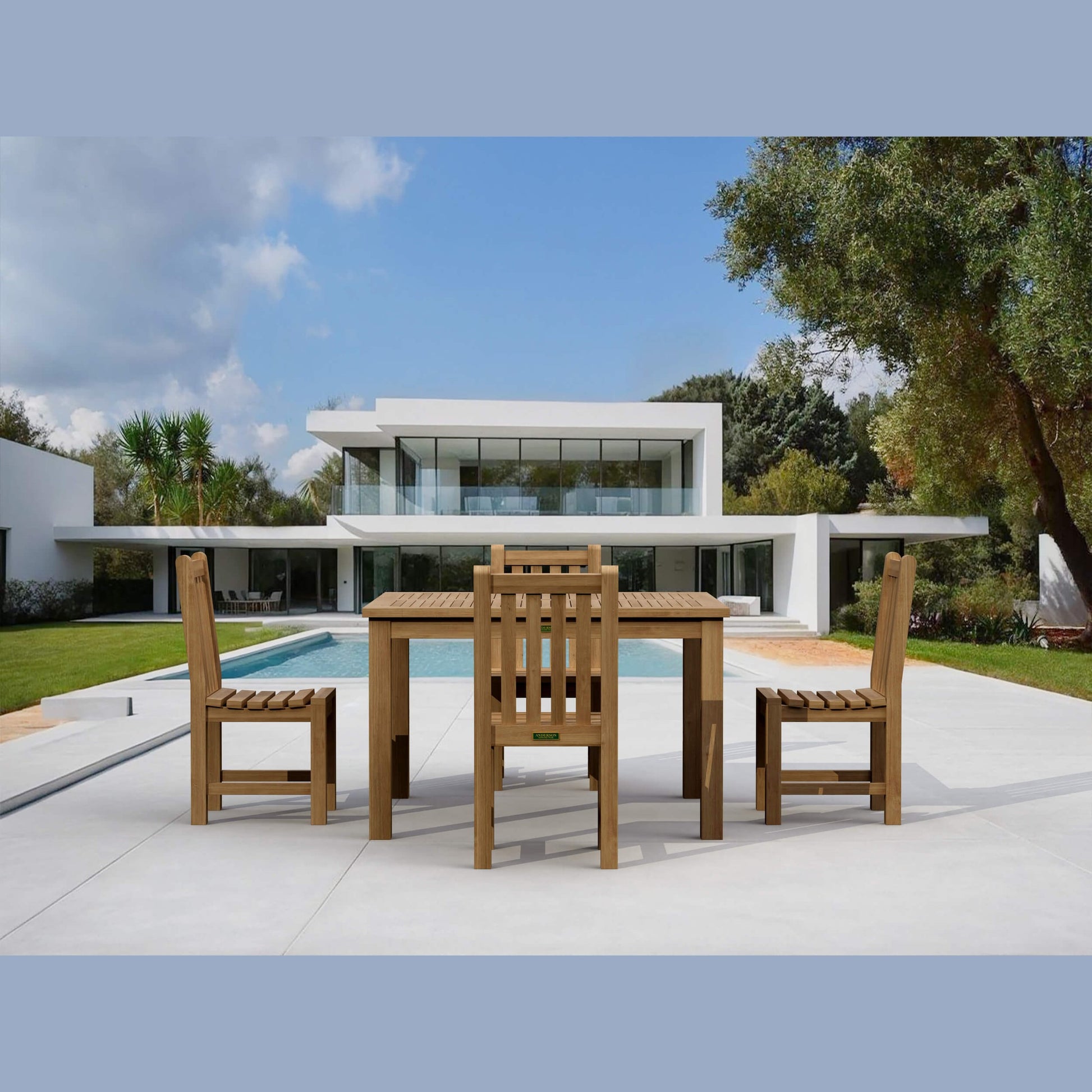 Wooden outdoor dining set with modern house and pool in the background