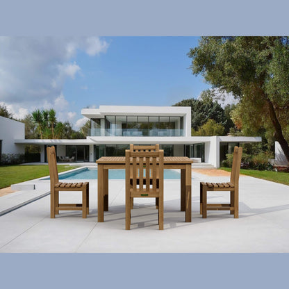 Wooden outdoor dining set with modern house and pool in the background