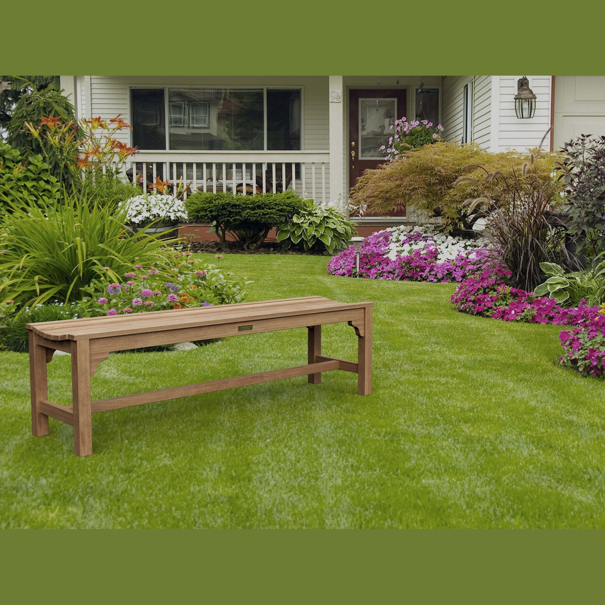 Wooden bench on a well-maintained lawn with flowers and a house in the background