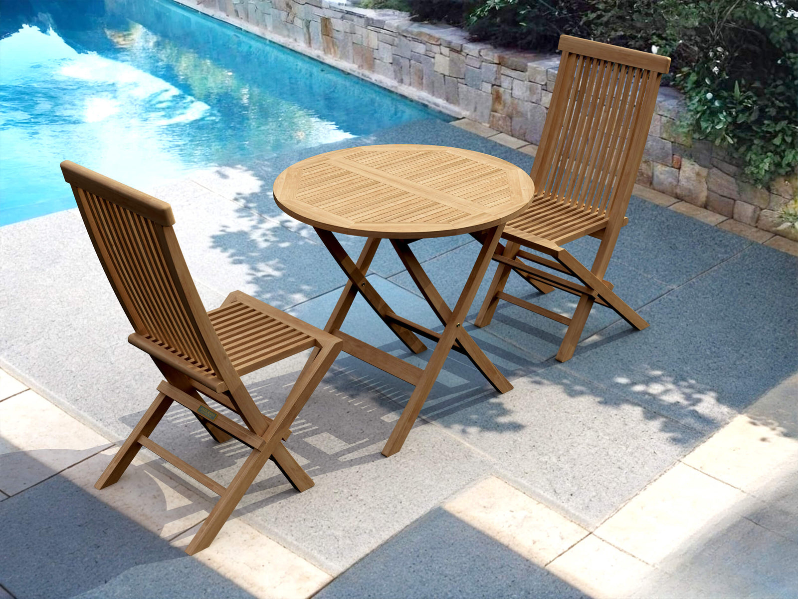 Wooden outdoor table and chairs by a pool