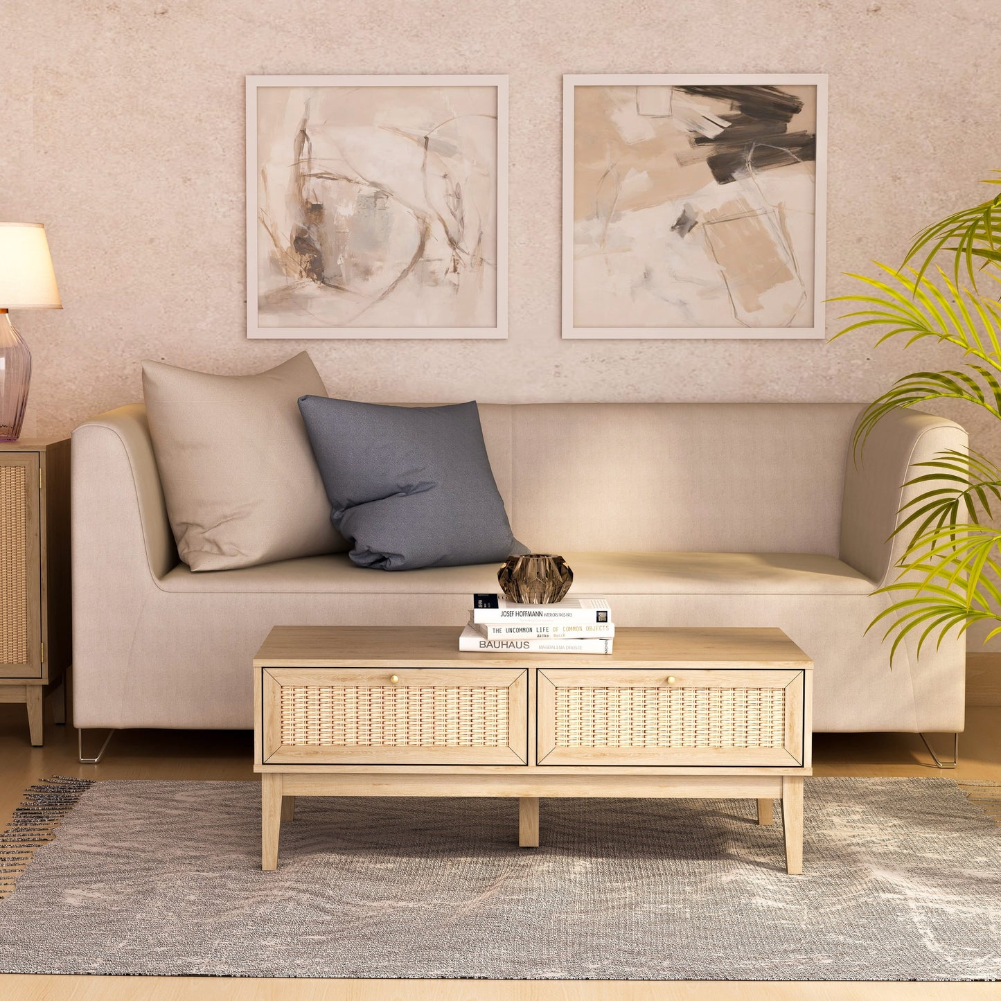 Living room with beige sofa, wicker coffee table, and abstract art on the wall.