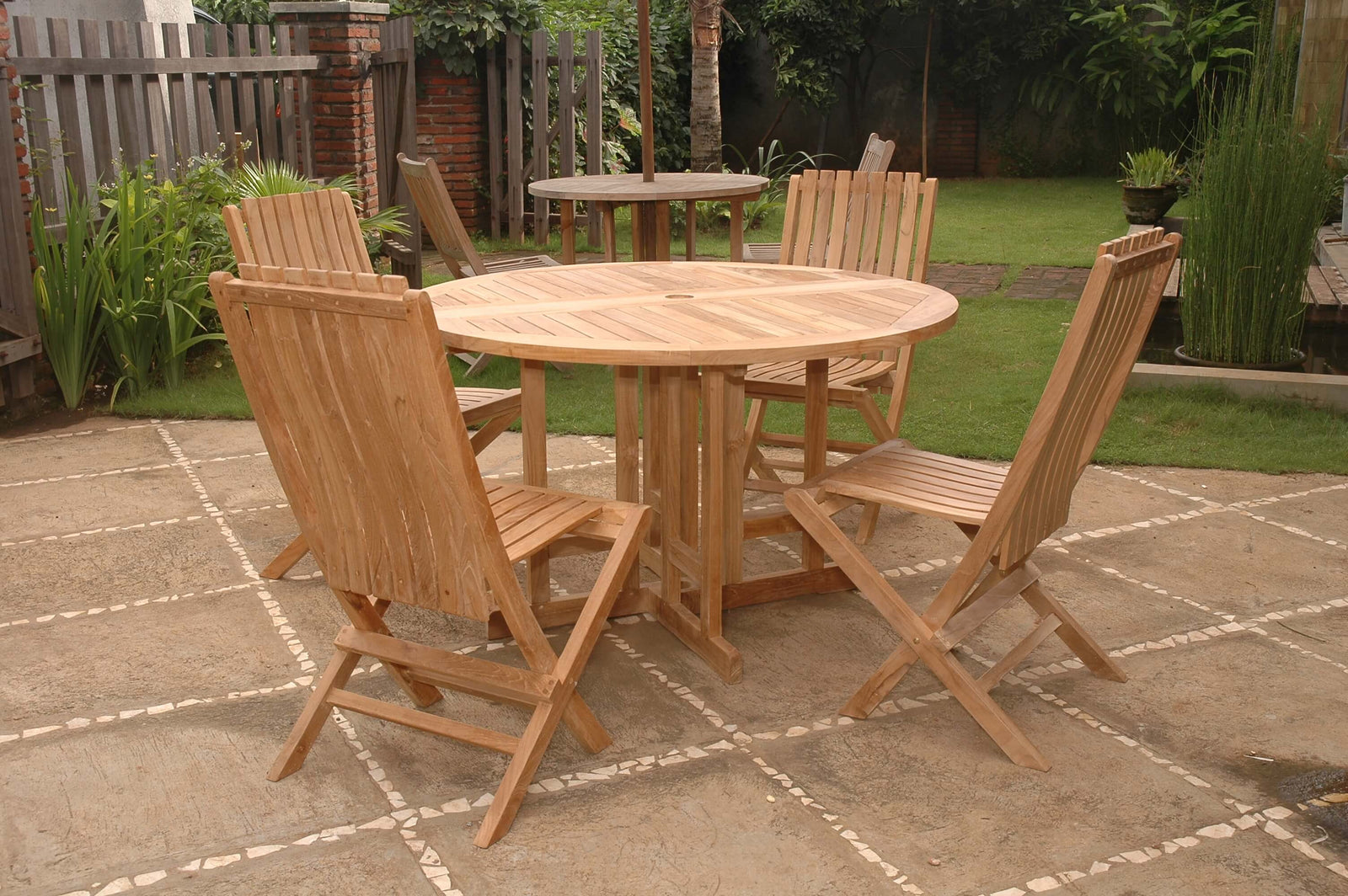 Wooden outdoor dining set with table and chairs on a patio