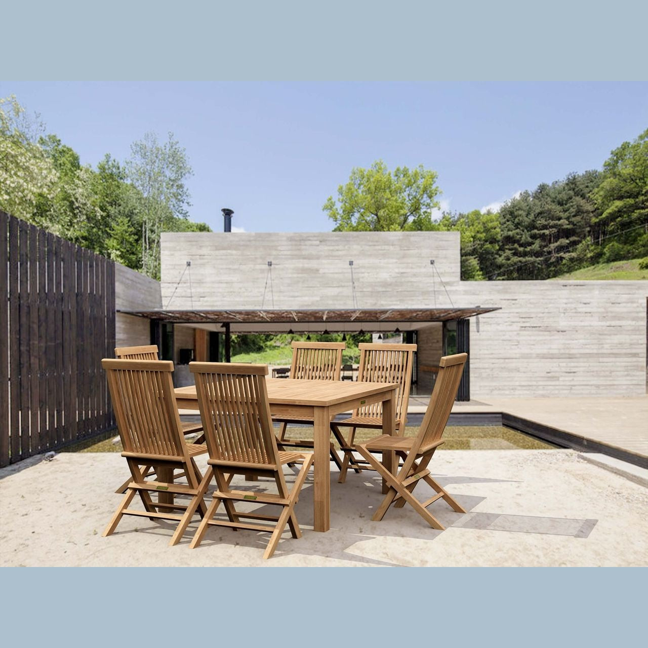 Wooden outdoor dining set with chairs on a patio area.