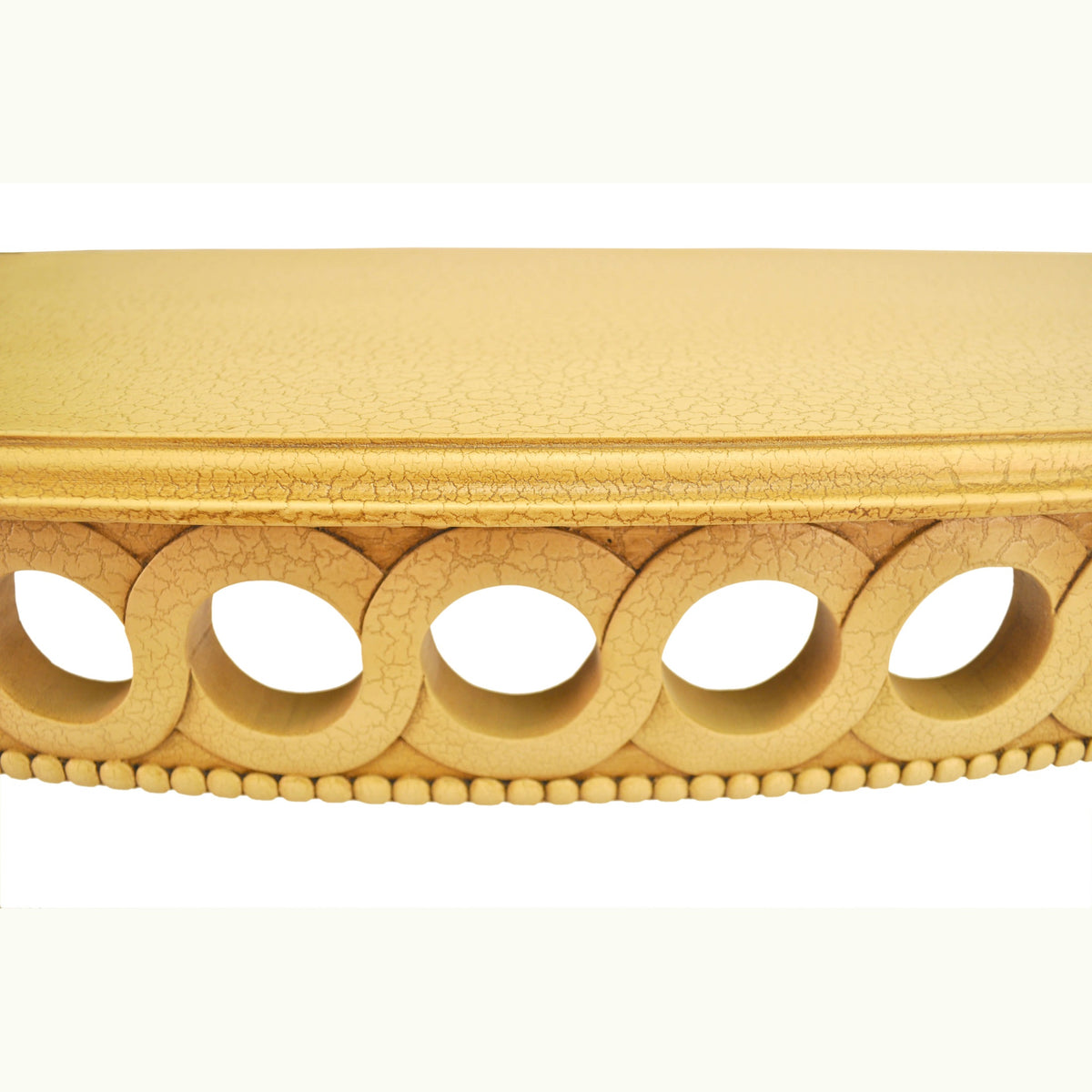 Decorative wooden molding with circular cutouts on a white background