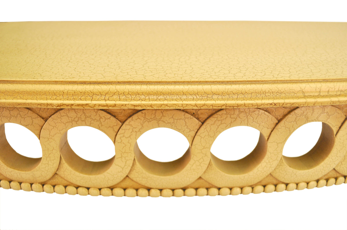 Decorative wooden molding with circular cutouts on a white background