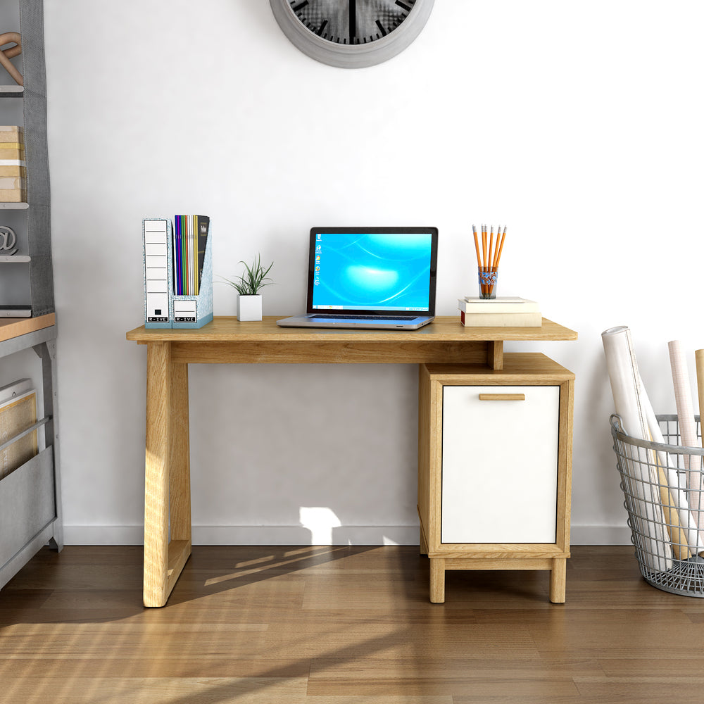 Wooden desk with a laptop, books, and office supplies in a home office setting.
