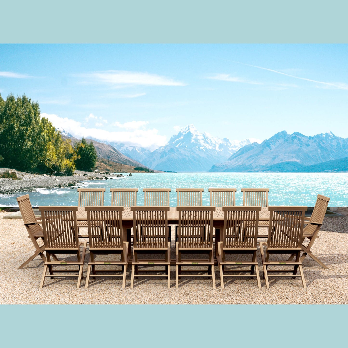 Wooden outdoor dining set with chairs by a lake and mountains