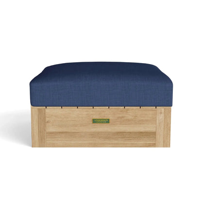 Wooden ottoman with a blue cushion on a white background