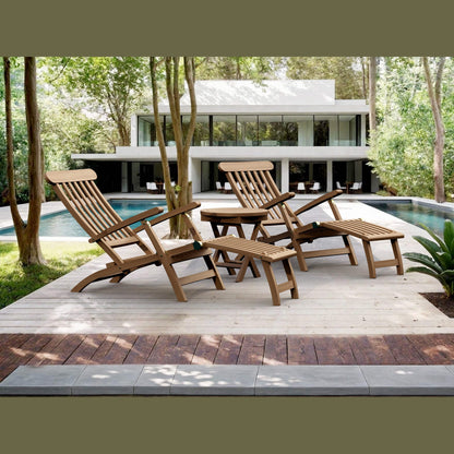 Wooden lounge chairs on a wooden deck by a pool with a modern house in the background.