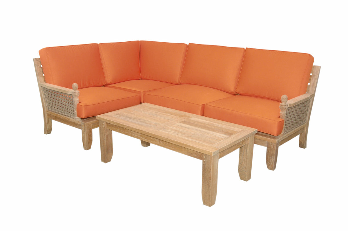Sectional outdoor sofa with orange cushions and a wooden coffee table on a white background