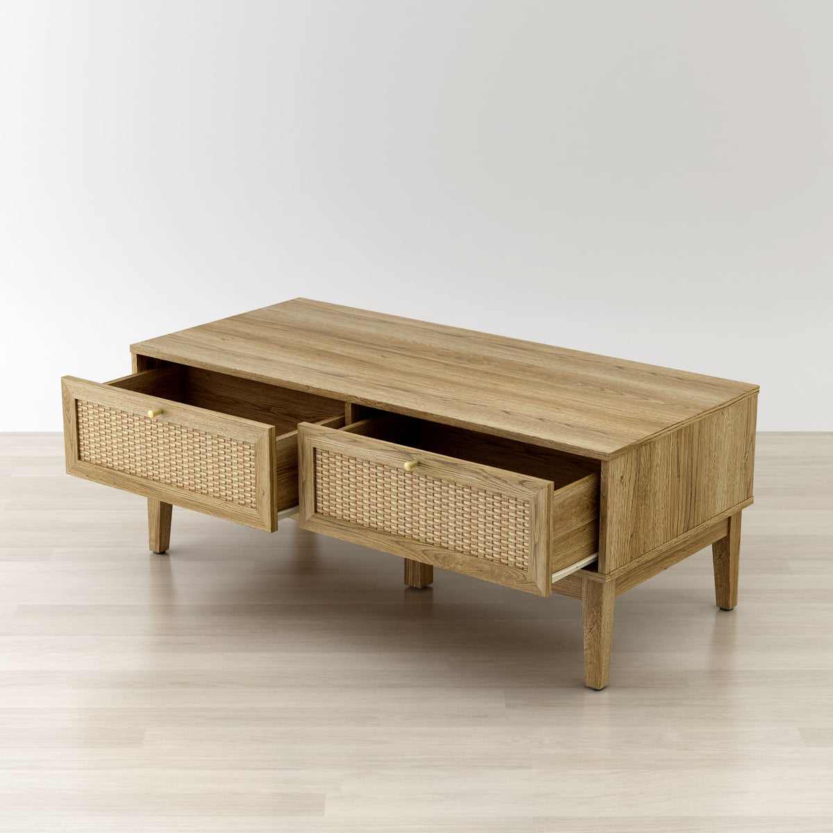 Wooden coffee table with wicker drawers on a light wooden floor.