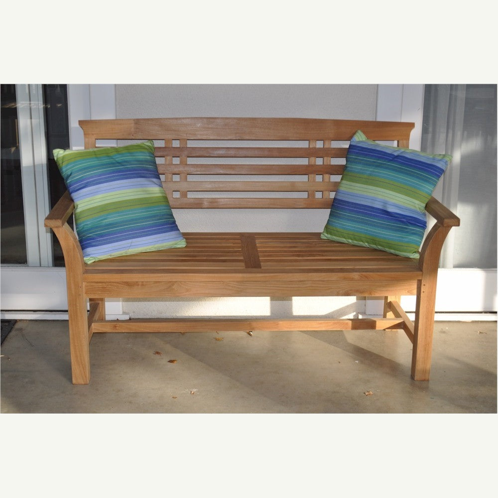 Wooden bench with striped cushions on a patio