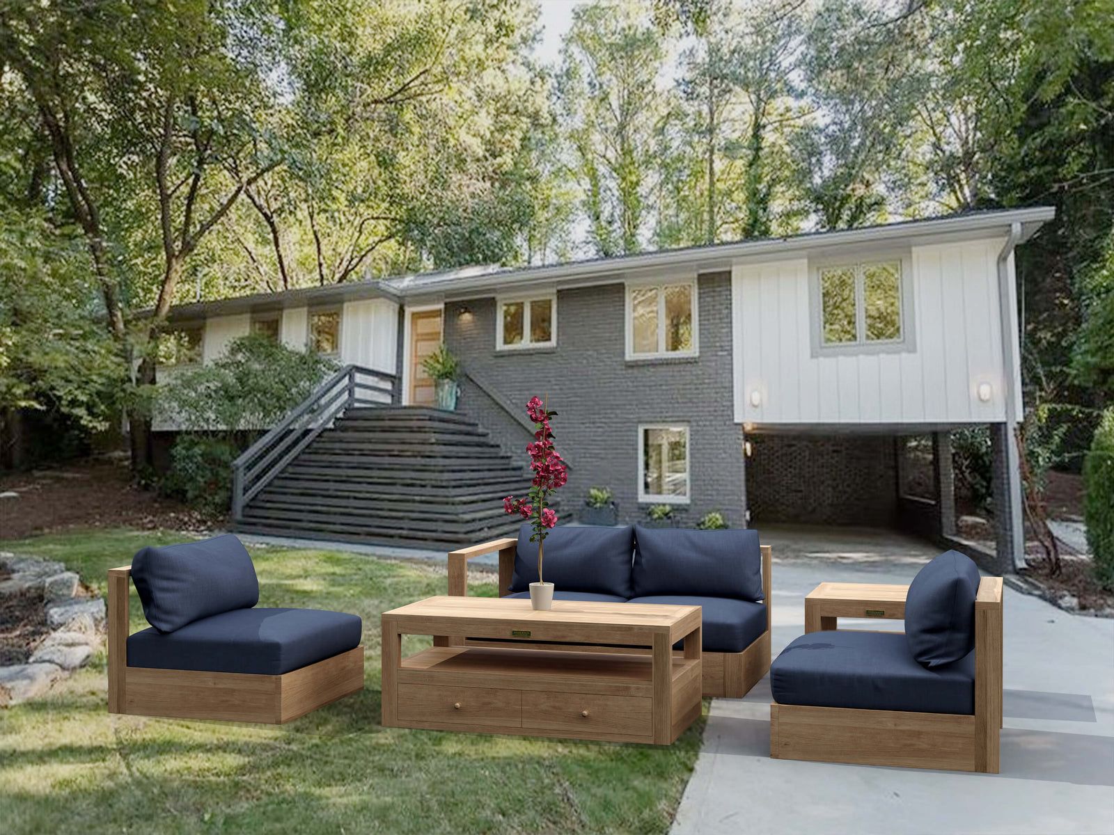 Outdoor patio set with wooden furniture and blue cushions in a backyard setting.
