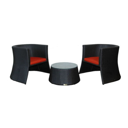 Black wicker chairs with red cushions and a matching round table on a white background