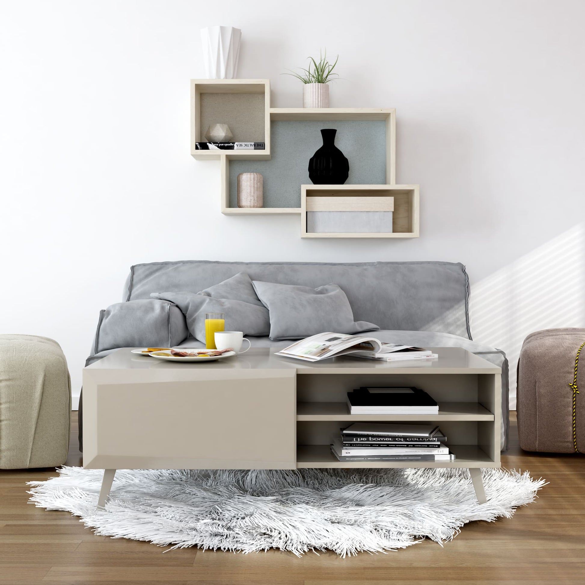 Modern living room with a gray sofa, coffee table, and decorative wall shelves.