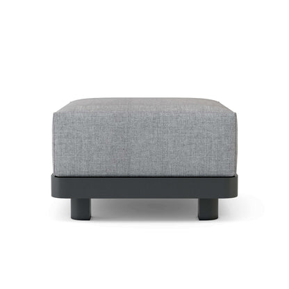 Gray upholstered ottoman with black legs on a white background