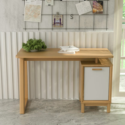 Wooden desk with a white cabinet against a wall with decorative elements