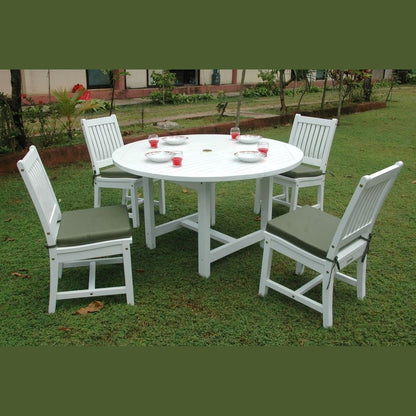 White round table with four matching chairs on a grassy area