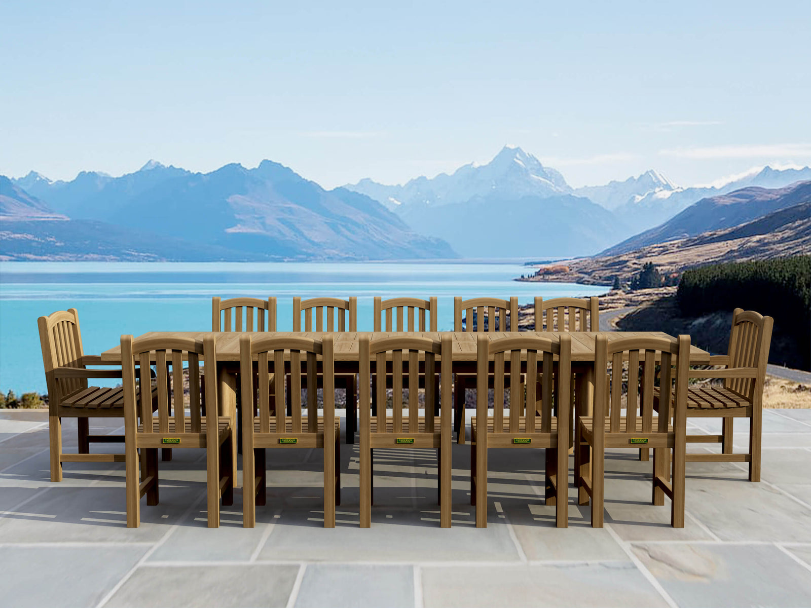 Wooden outdoor dining set with chairs and table in front of a scenic mountain and lake view.
