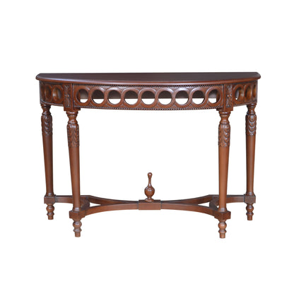 Wooden console table with intricate carvings on a white background