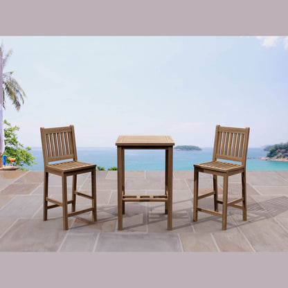 Wooden outdoor table and chairs set with a scenic ocean view.