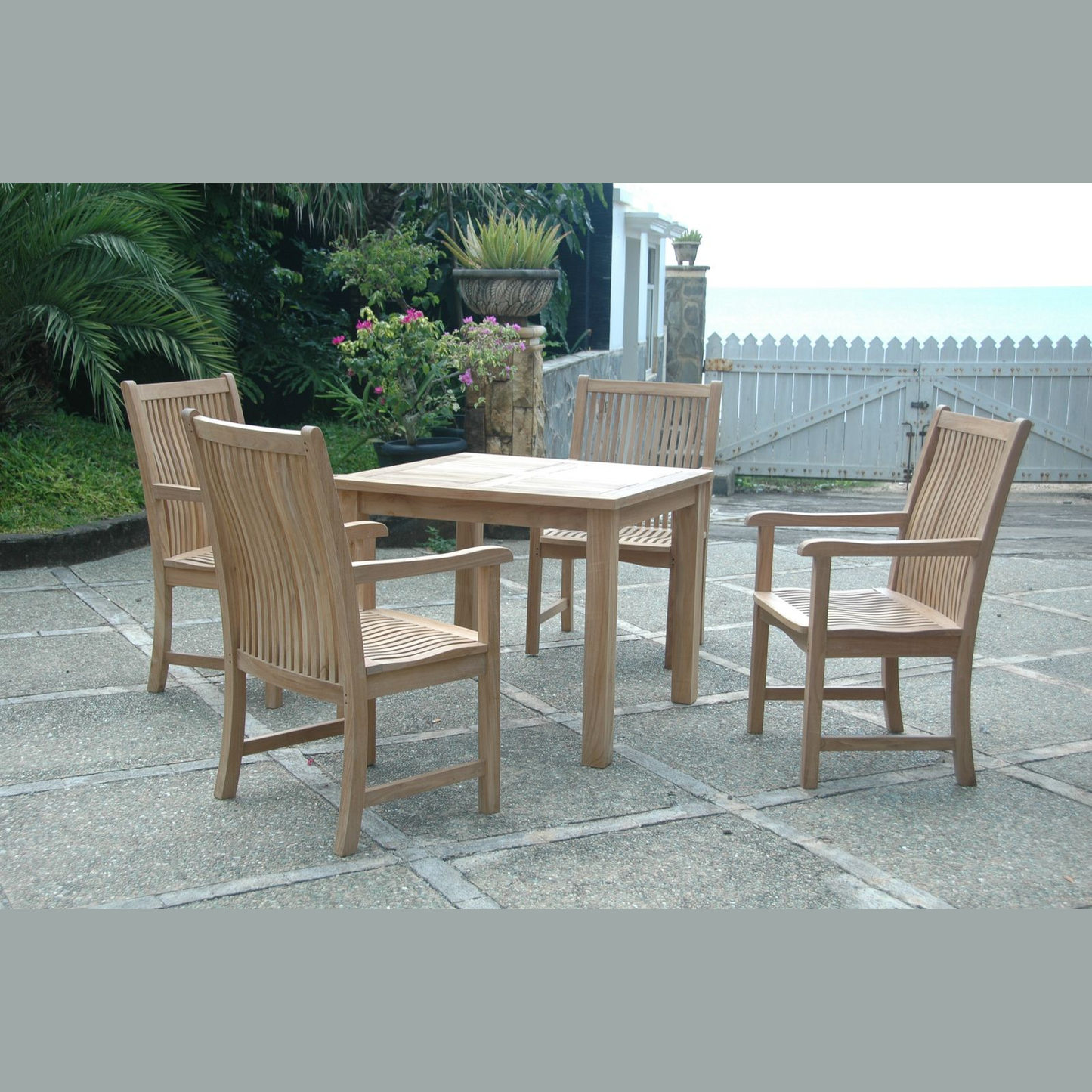 Wooden outdoor dining set with table and chairs on a patio