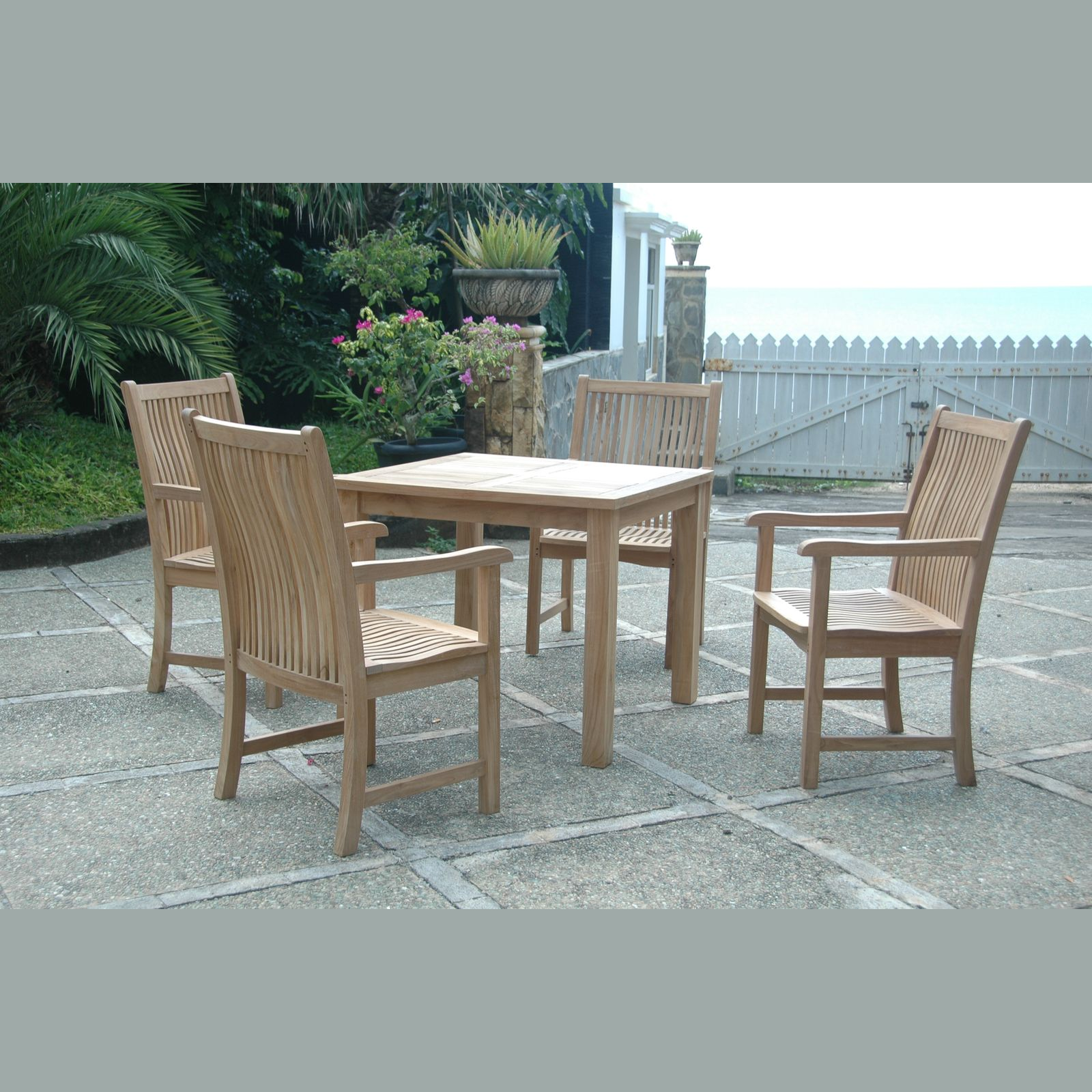 Wooden outdoor dining set with table and chairs on a patio