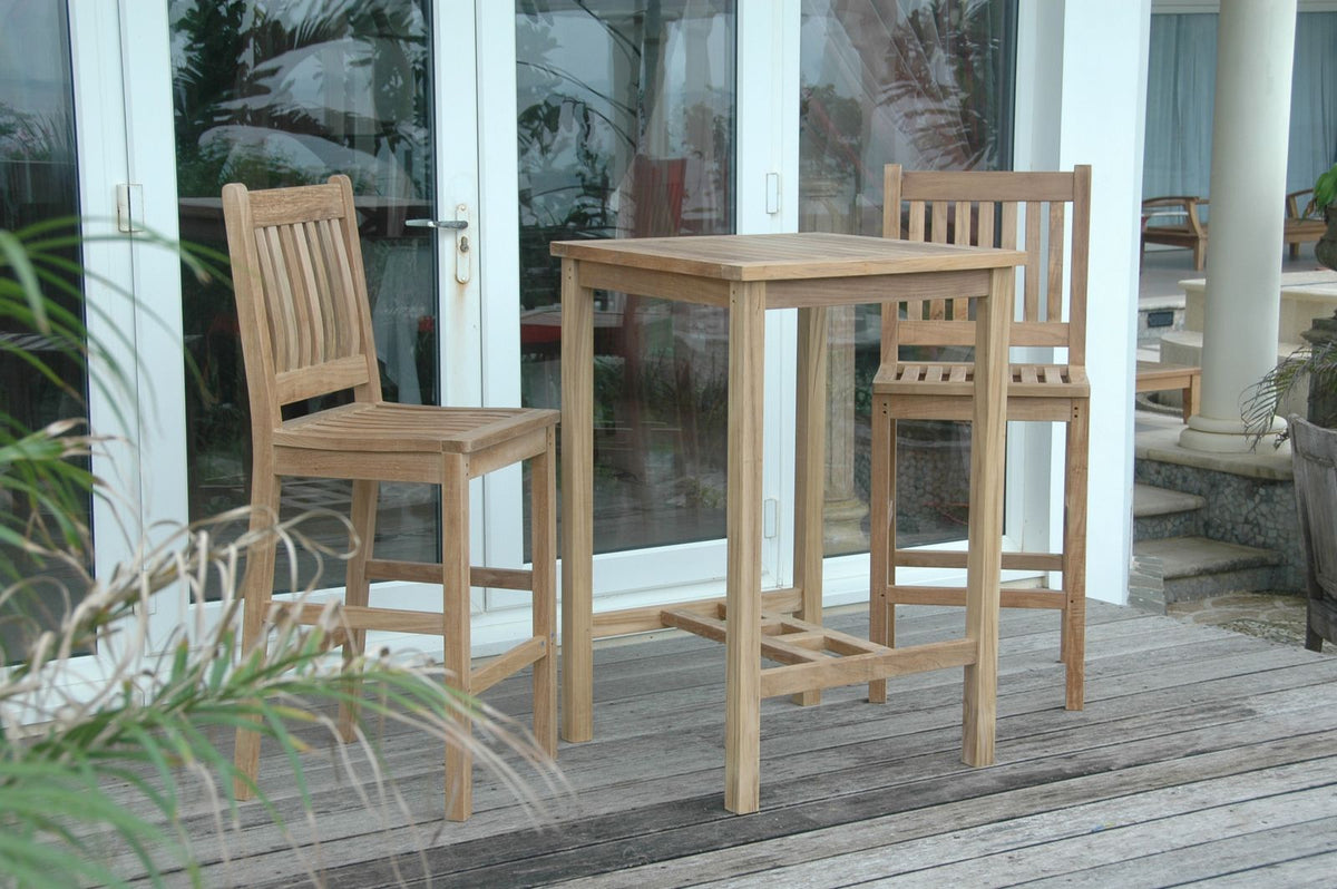 Wooden outdoor bar set with two stools on a patio