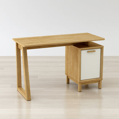 Wooden desk with a white cabinet door on a light wooden floor.