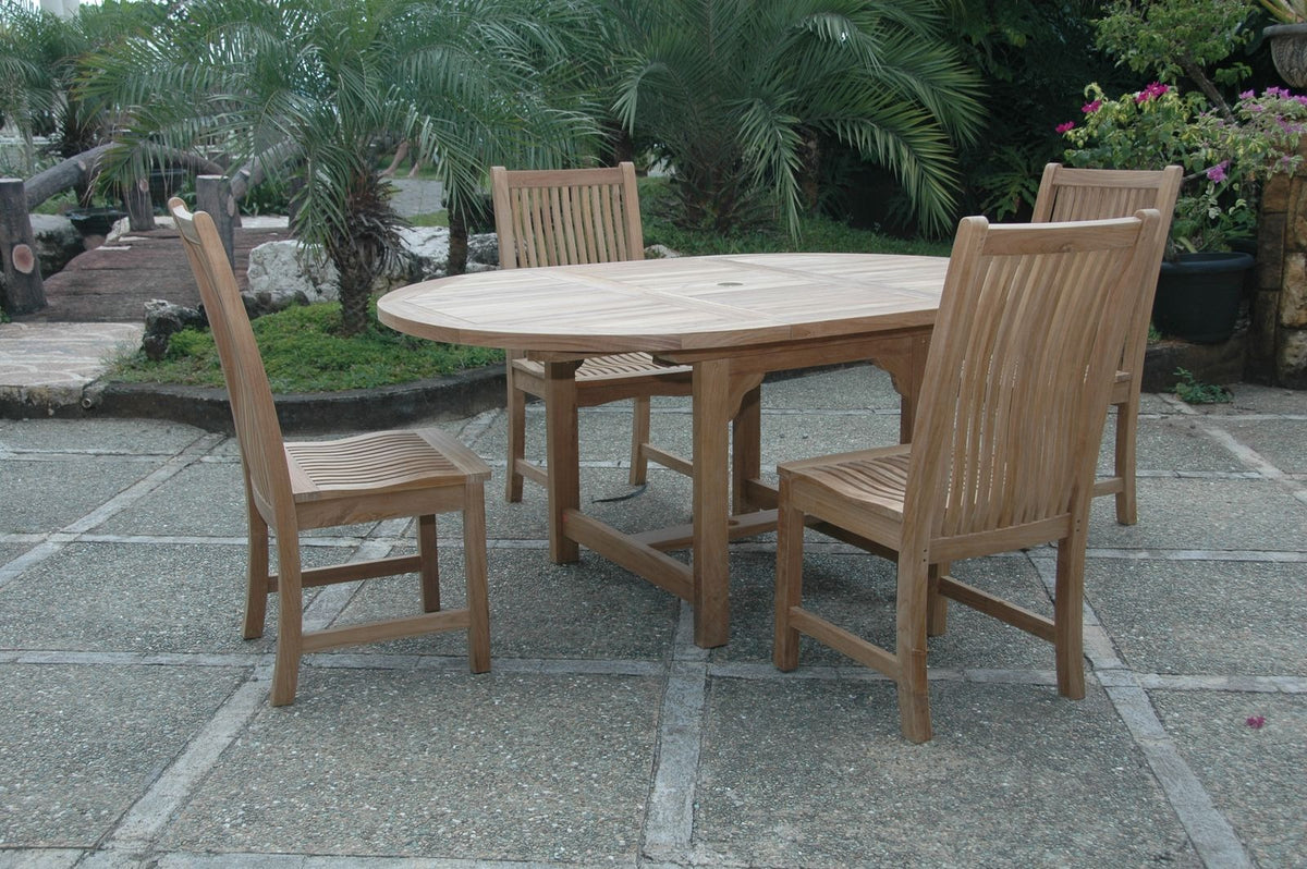 Wooden outdoor table with four matching chairs on a stone patio.