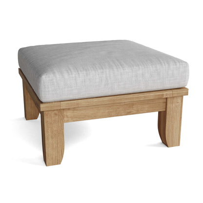 Wooden ottoman with a light gray cushion on a white background