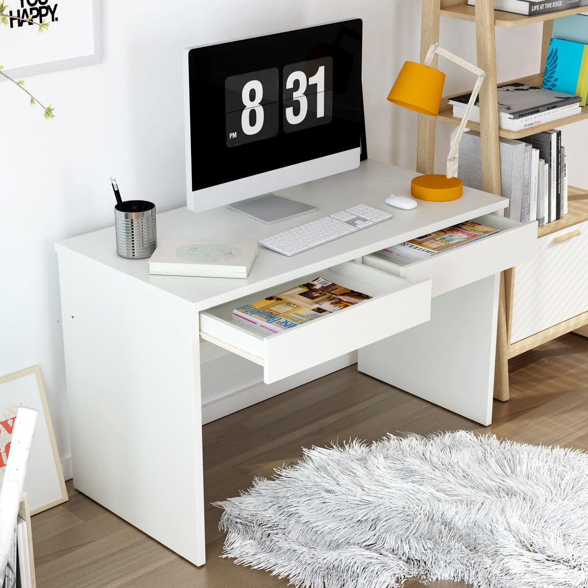 White office desk with computer setup in a home office setting