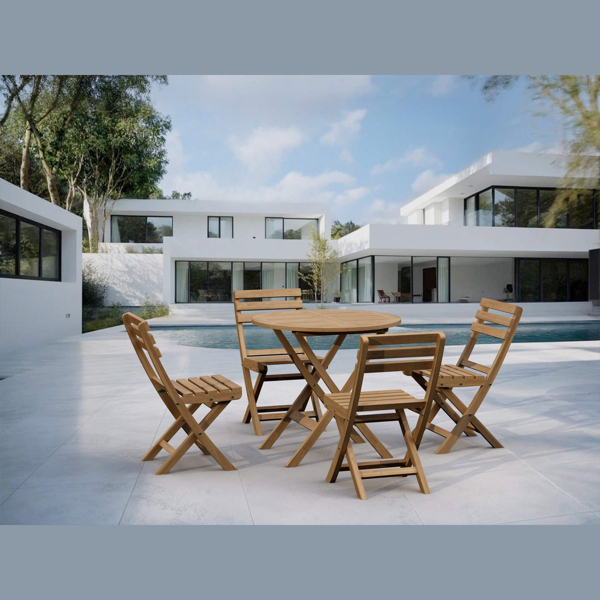 Wooden outdoor table and chairs in front of a modern house with a pool.