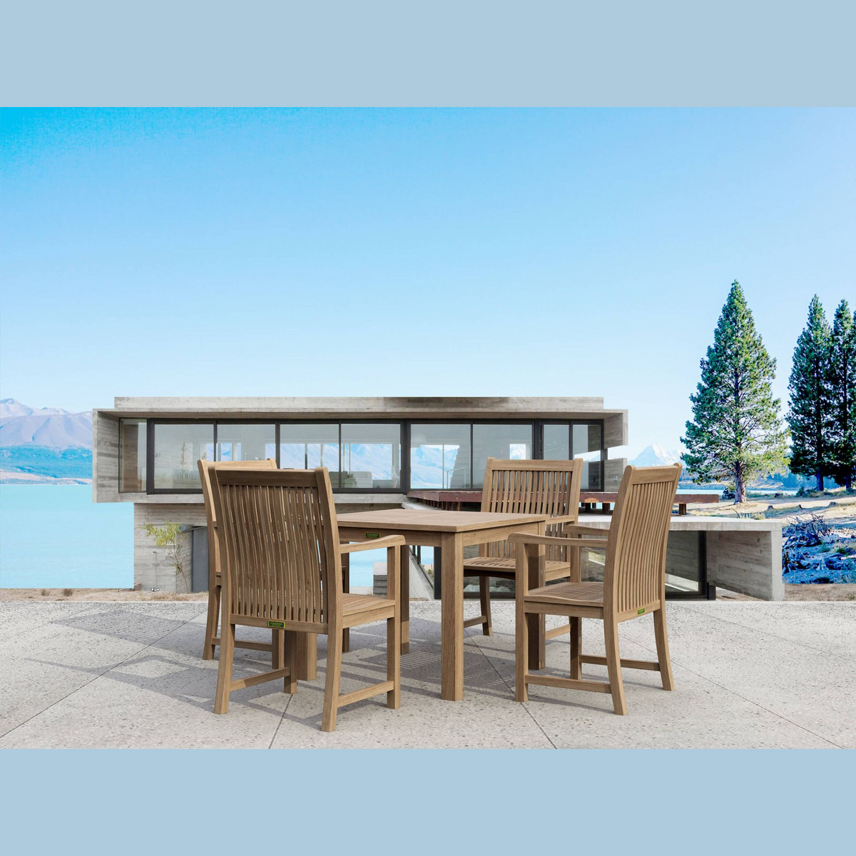 Outdoor dining set with table and chairs by a waterfront building.