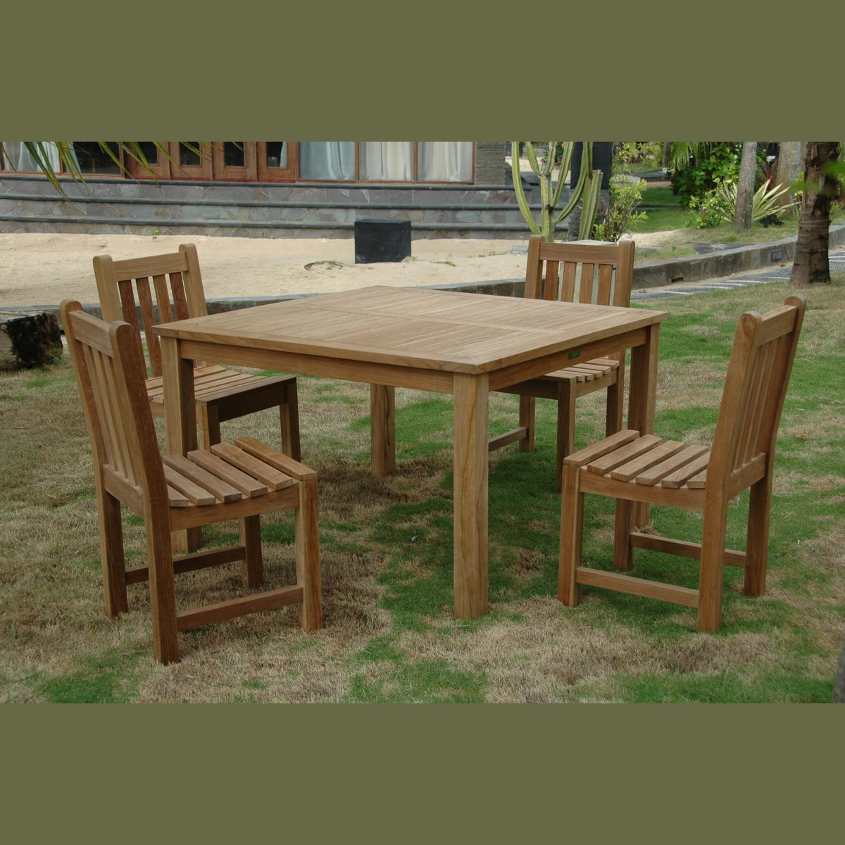 Wooden outdoor dining set with table and chairs on grass