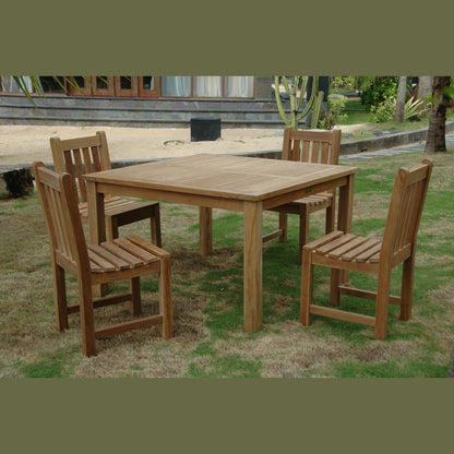 Wooden outdoor dining set with table and chairs on grass
