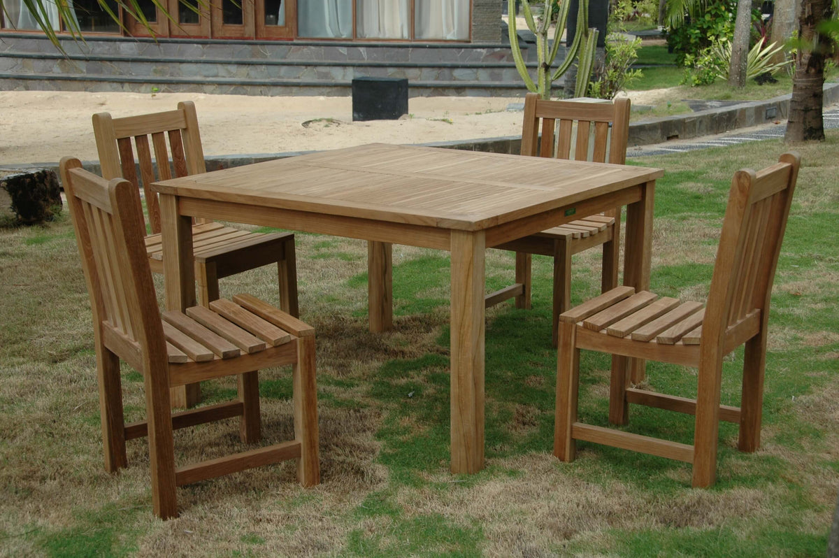Wooden outdoor dining set with table and chairs on grass