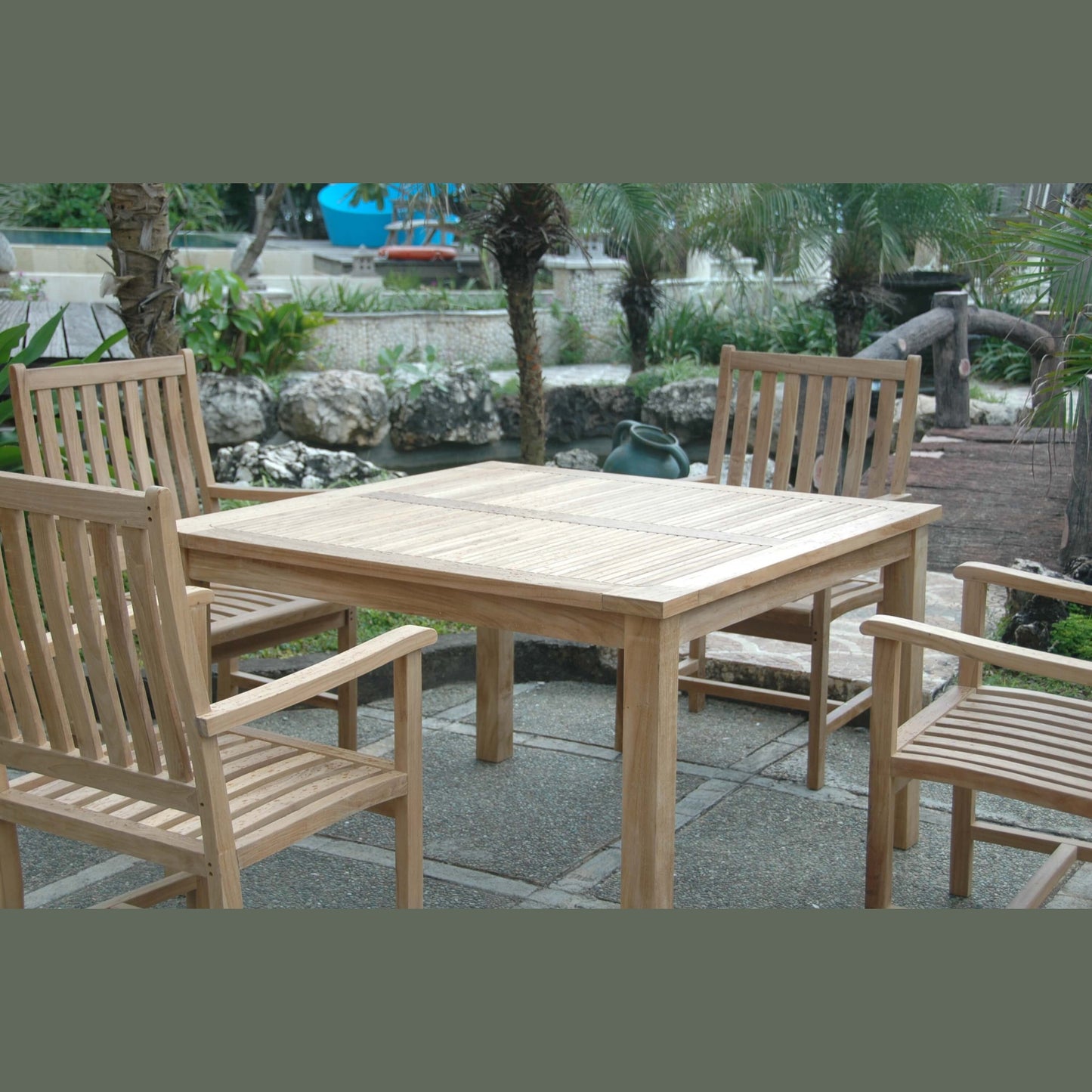 Wooden outdoor table and chairs in a garden setting