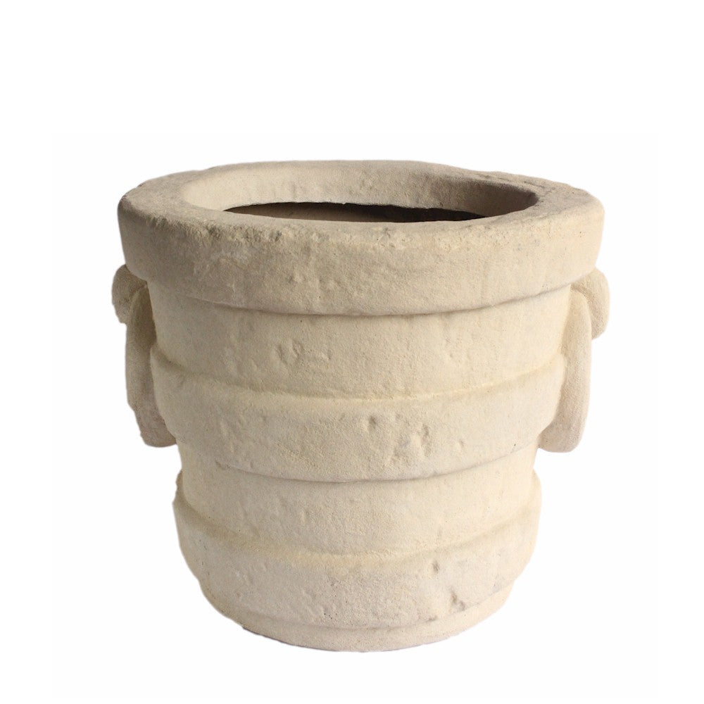 Beige stone planter with handles on a white background