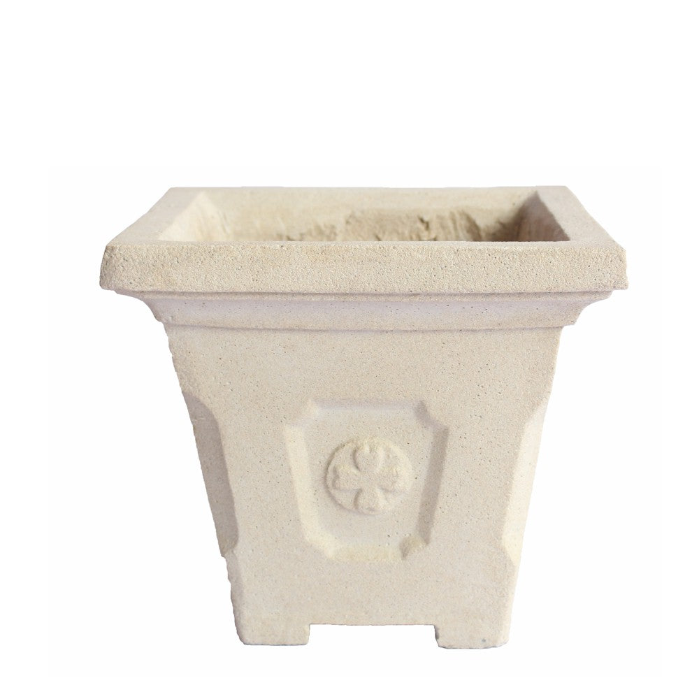 Beige square planter with decorative emblem on a white background