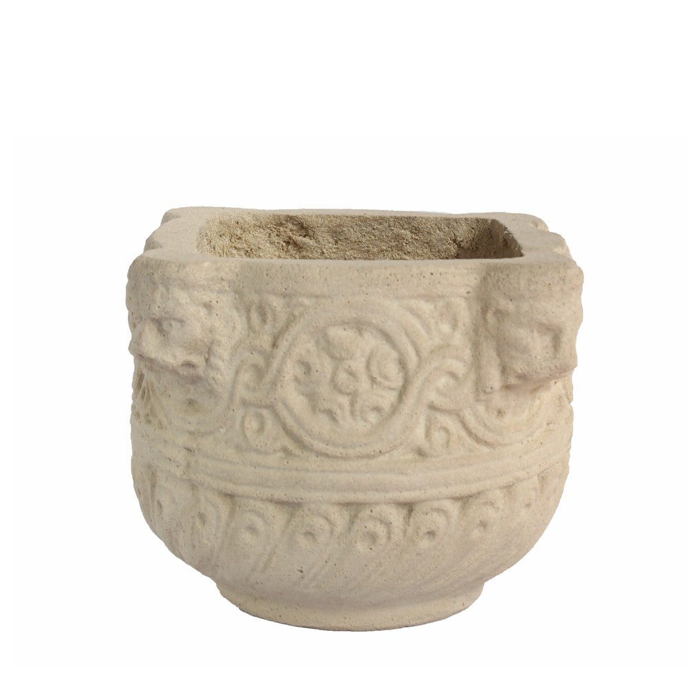 Decorative stone pot with intricate patterns on a white background