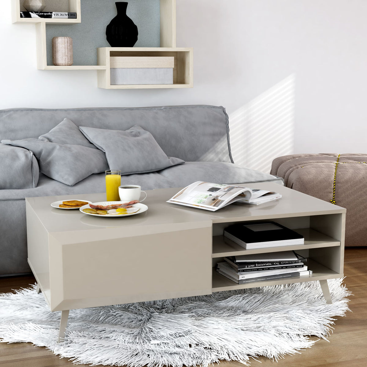 Modern living room with a gray sofa, coffee table, and decorative items.