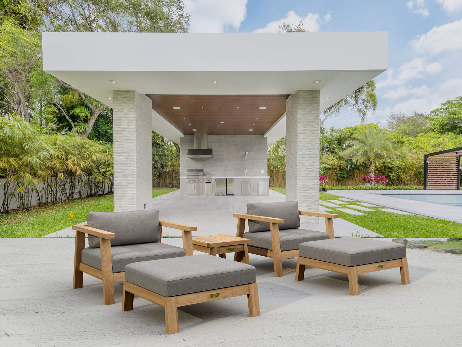 Outdoor patio with wooden furniture and a covered area.