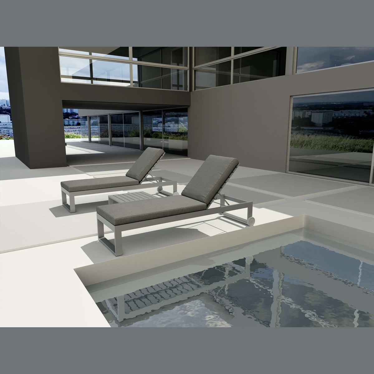 Two gray lounge chairs by a poolside with a modern building in the background