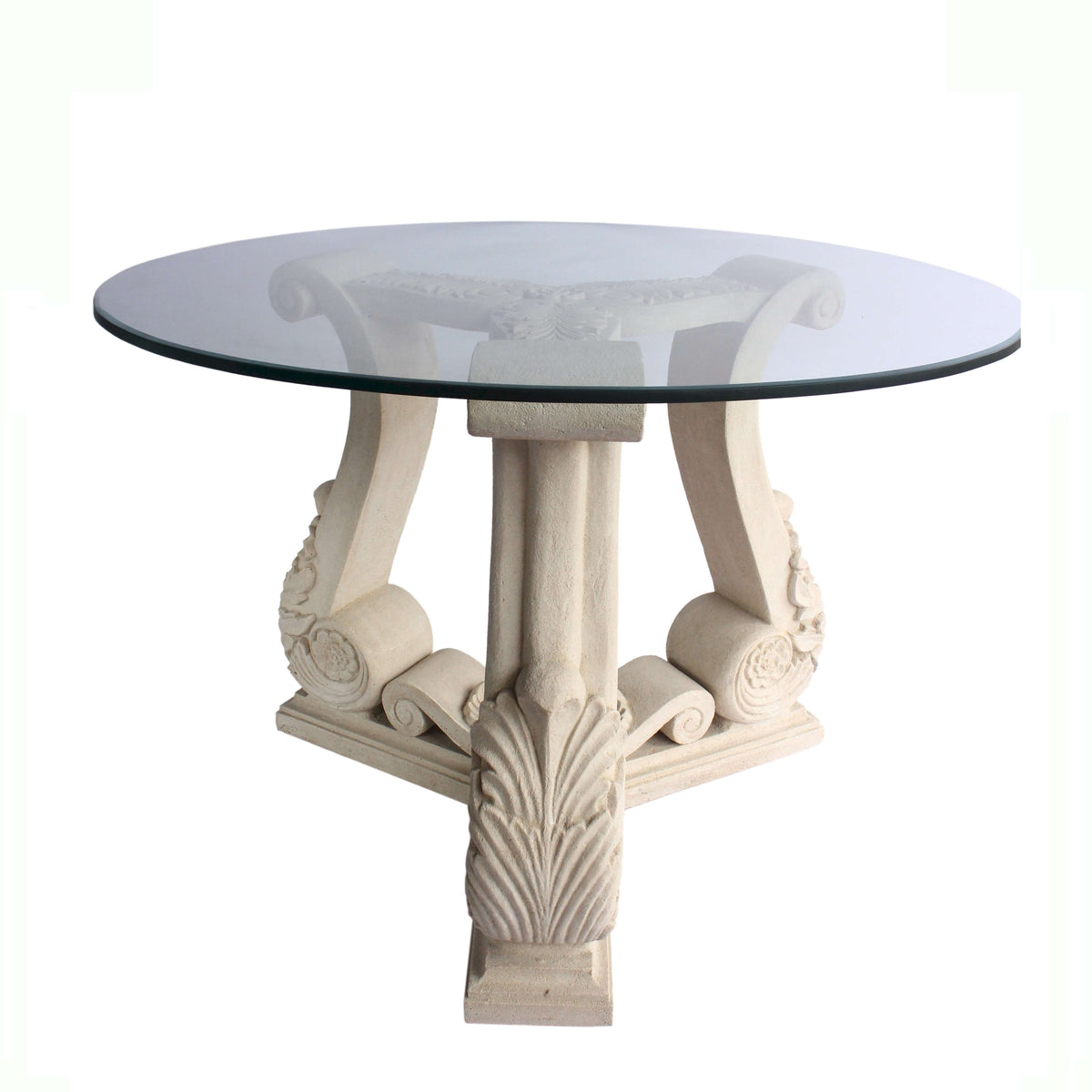 Round glass-top table with decorative white legs on a white background