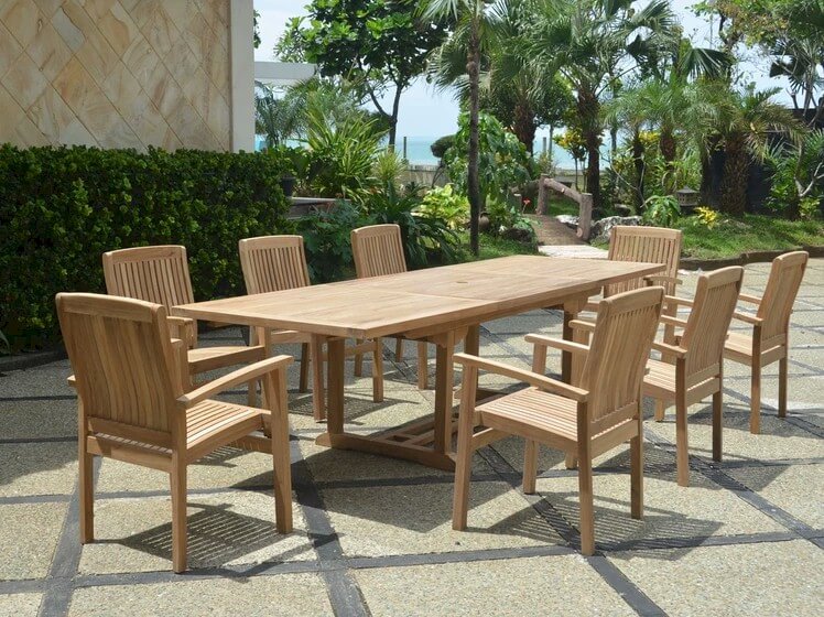 Wooden outdoor dining set with table and chairs on a patio