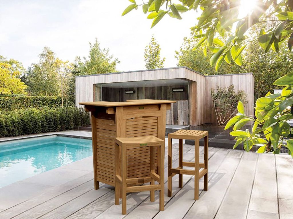 Outdoor patio set with bar table and stools by a poolside