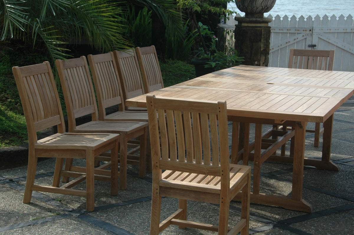 Wooden outdoor dining set with table and chairs on a patio