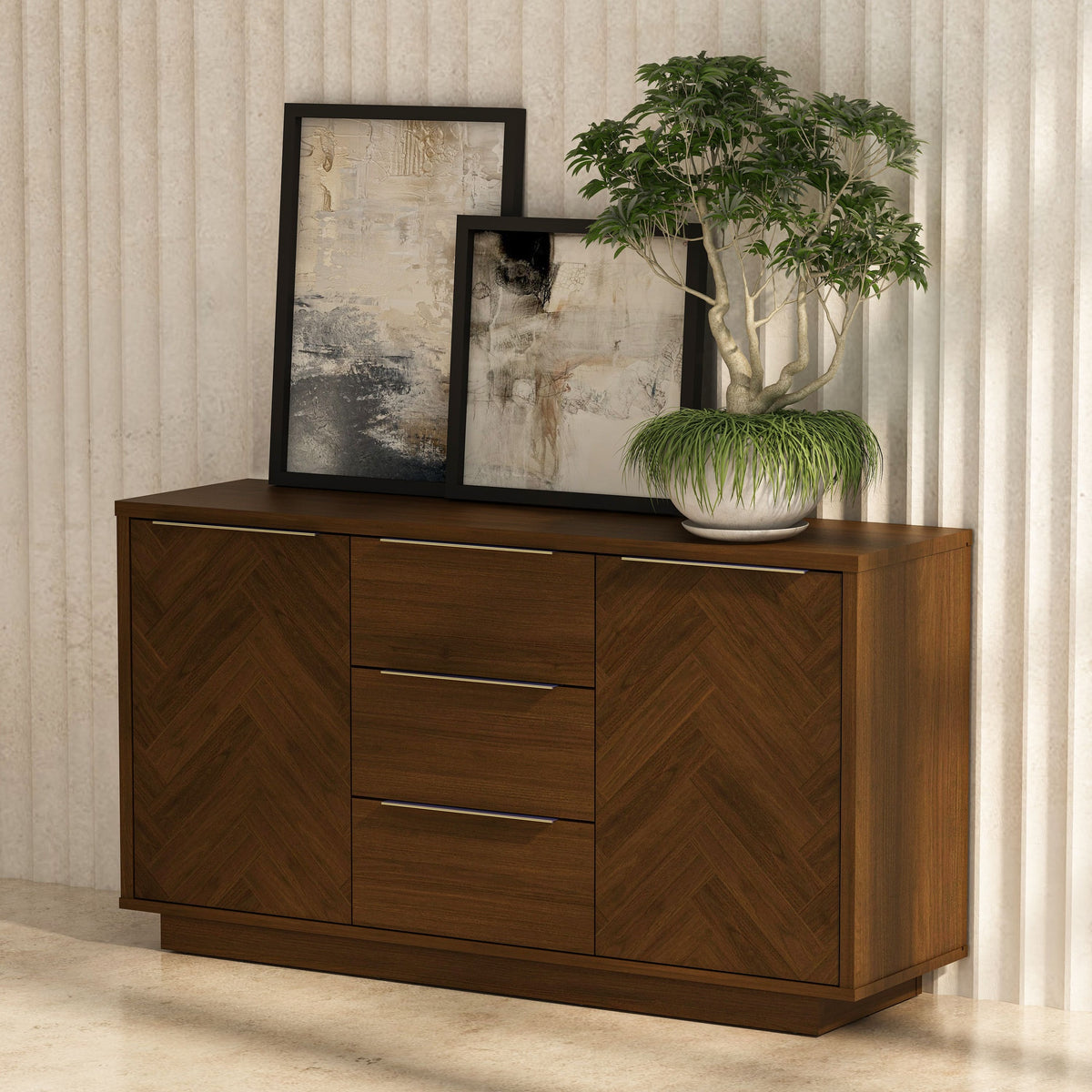 Wooden sideboard with two drawers, a plant, and framed artwork against a neutral wall.